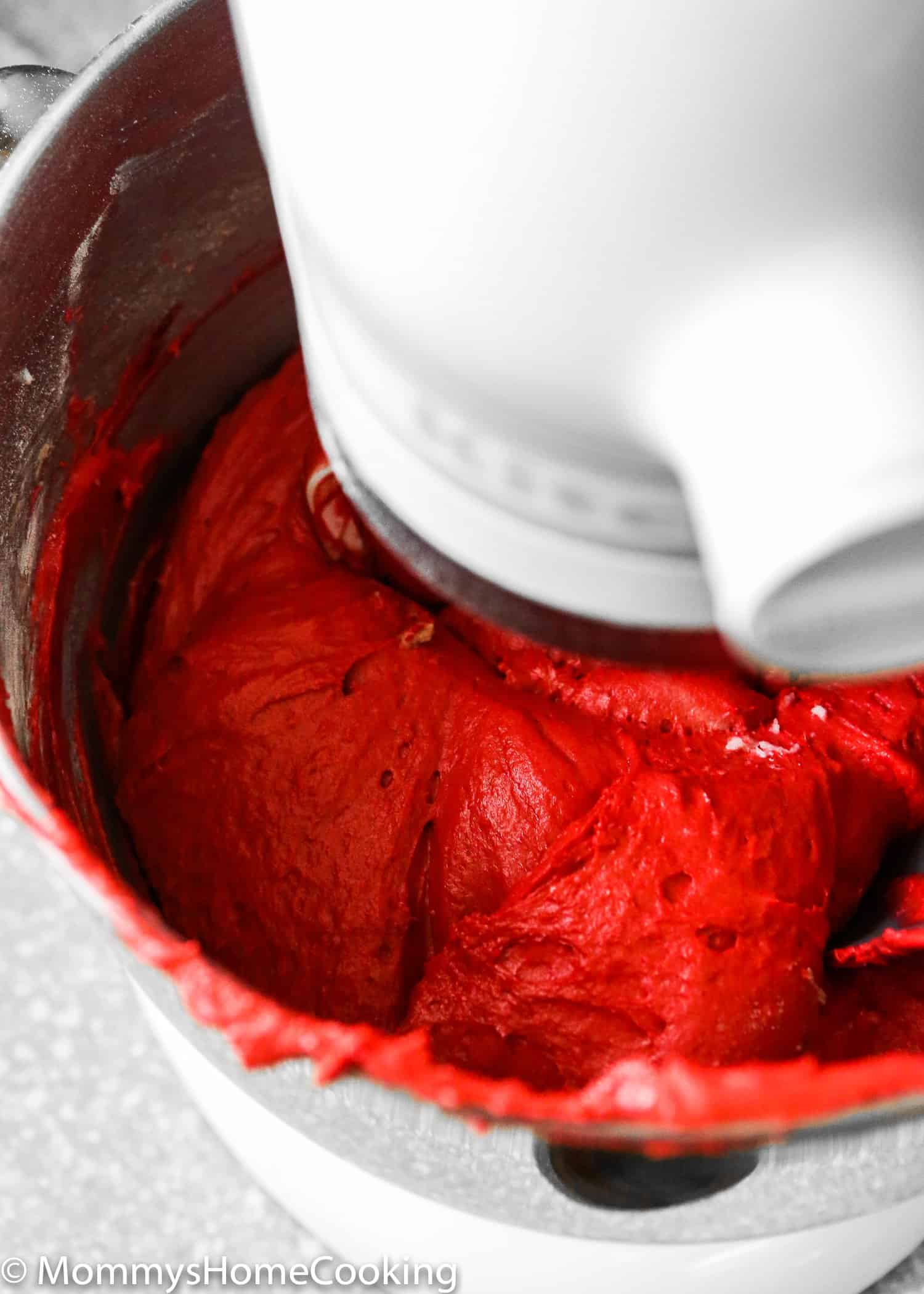Red velvet batter in a mixer.