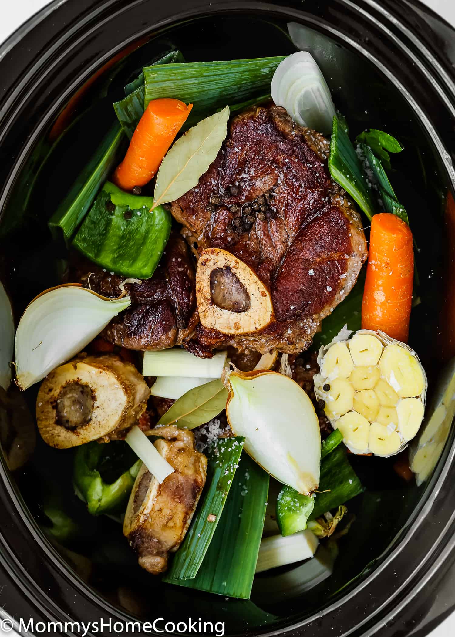 This Slow Cooker Beef Bone Broth is rich in nutrients and super tasty! It's easy to make and it's a money saver, too. Enjoy it on its own or use it to make your favorite stew, soup, and many other dishes. https://mommyshomecooking.com