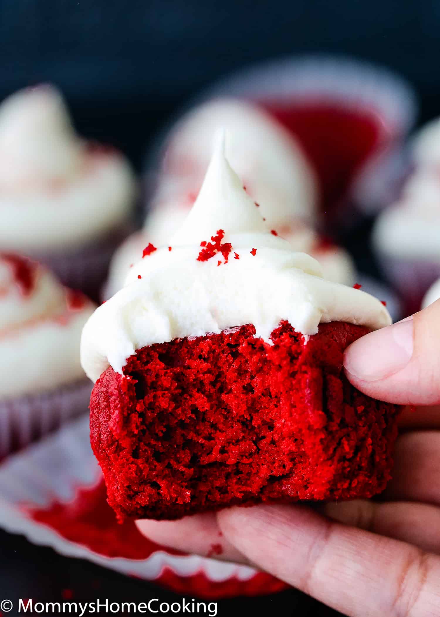 bitten eggless red velvet cupcakes showing fluffy inside texture