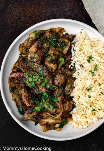 liver and onion with white rice in a plate