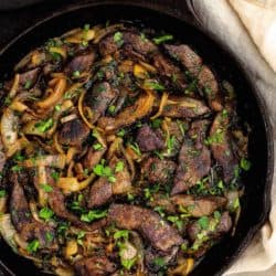Venezuelan Beef Liver and onions in a cast iron skillet