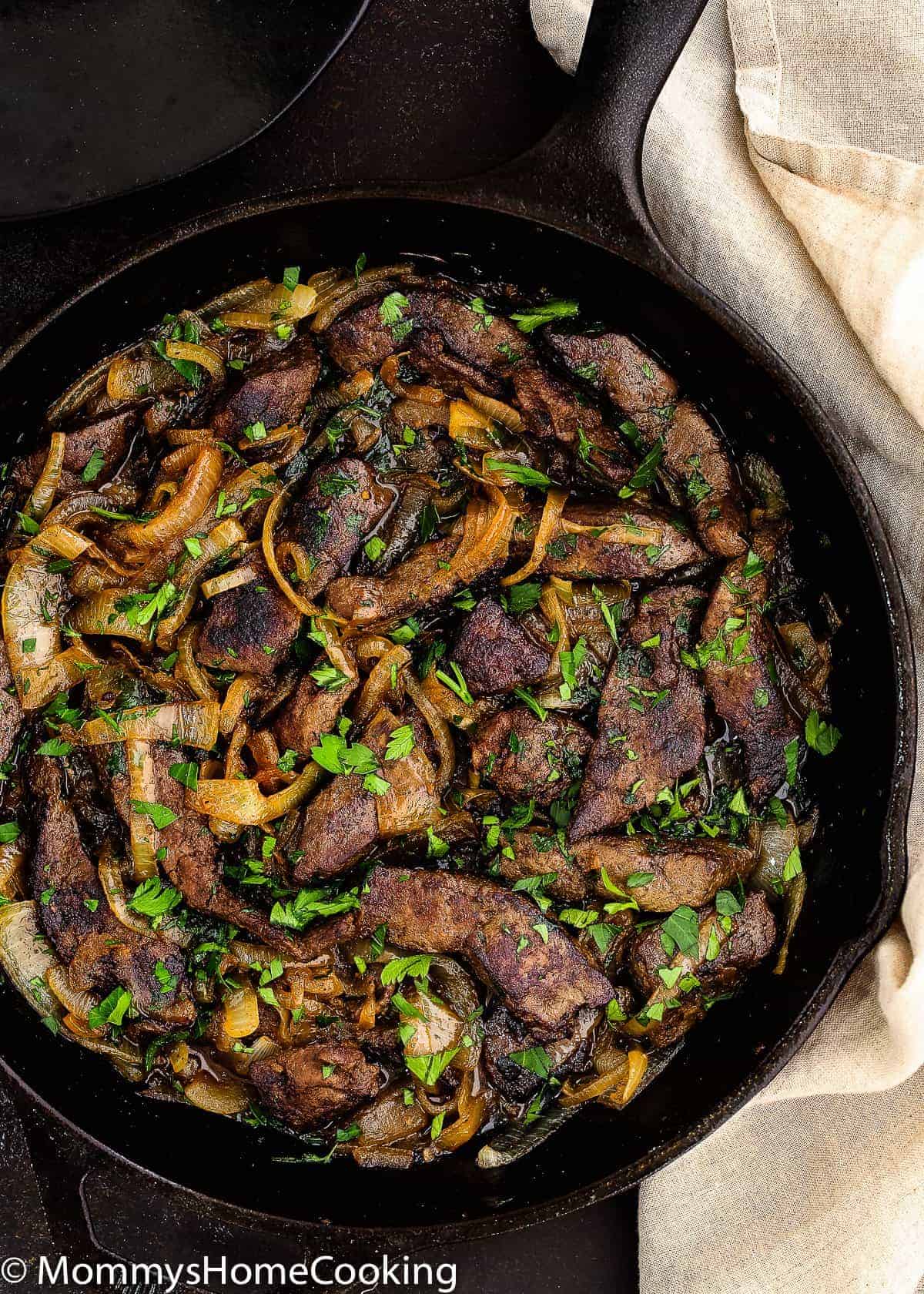 Venezuelan Beef Liver and Onions in a skillet. 