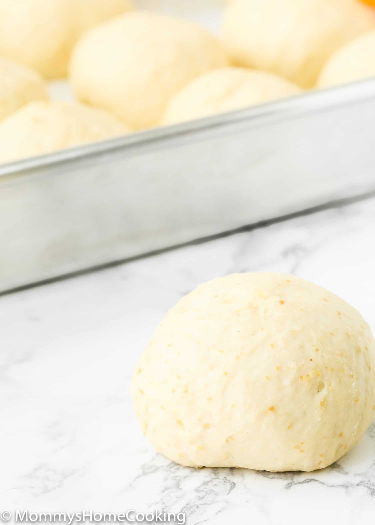 A close up of a single dough ball before baking.