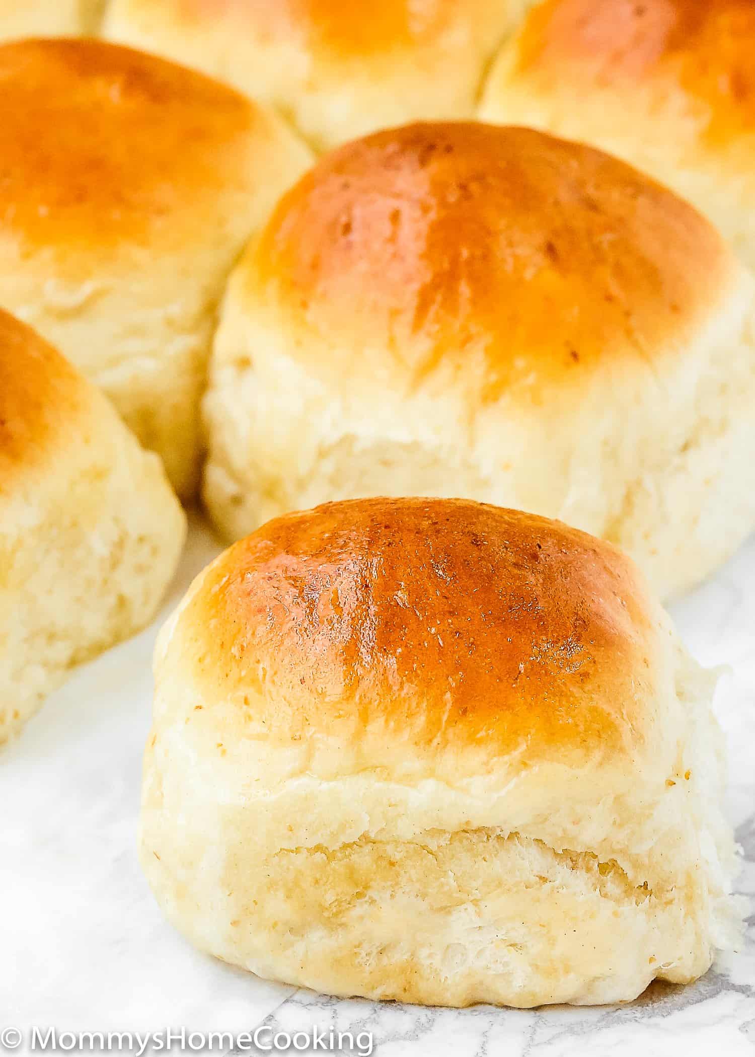 Close up of a freshly baked no knead dinner roll without egg.