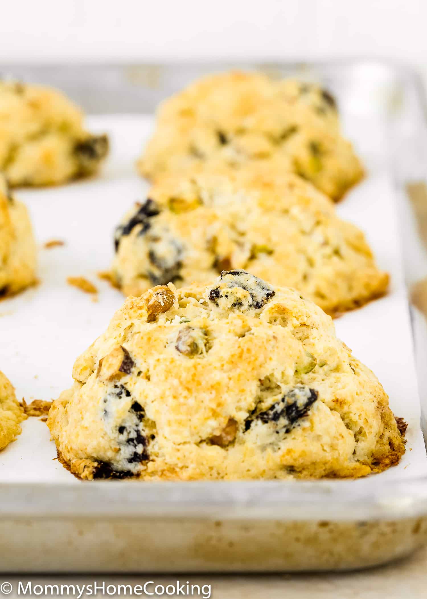 These Eggless Prune-Pistachio Scones are über buttery and flaky! Made from scratch with California prunes and pistachios, these scones make a delightful sweet treat for any occasion. They will be a big hit every time you make them. https://mommyshomecooking.com