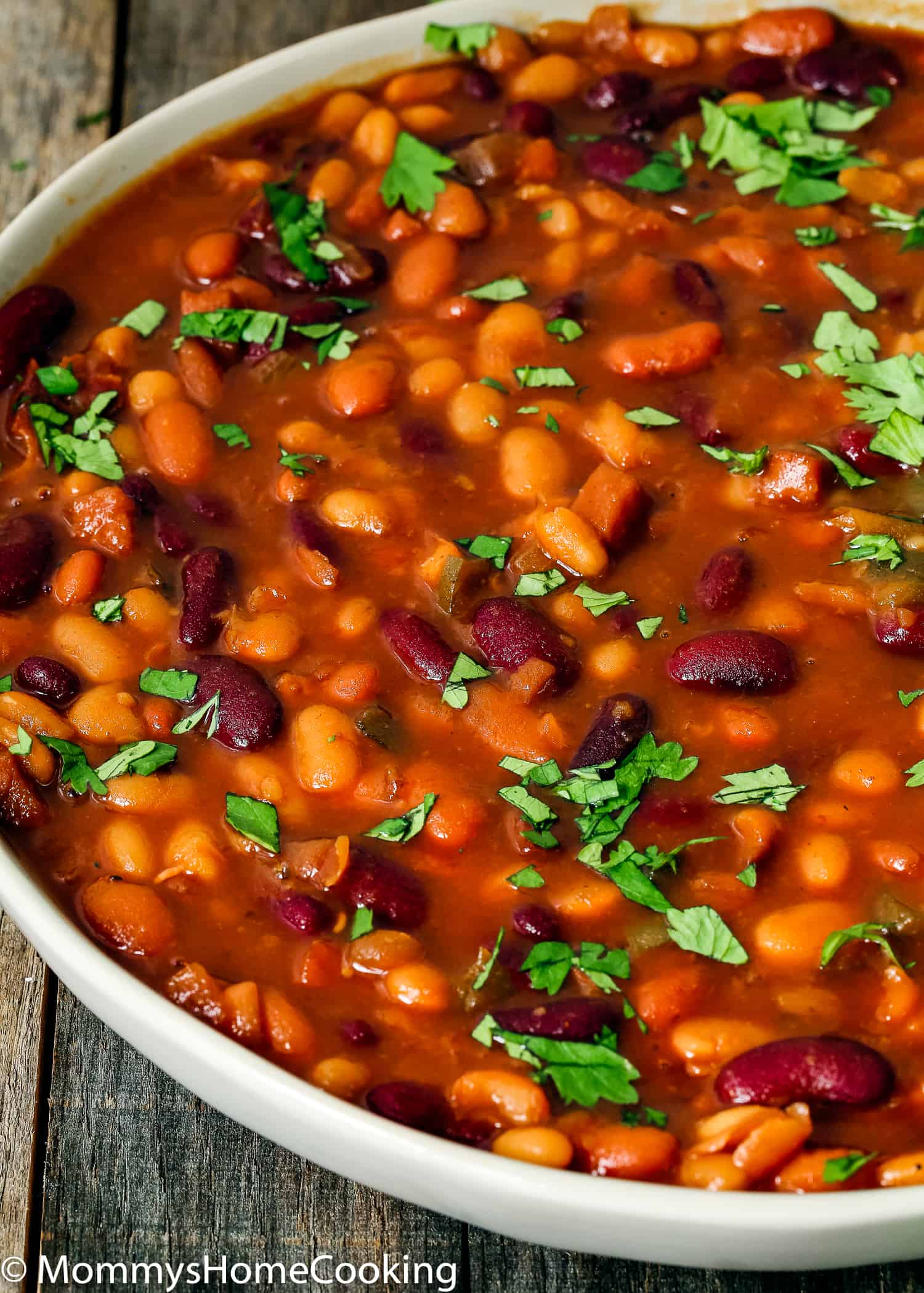 Closeup of Instant Pot Baked Beans garnished with cilantro.