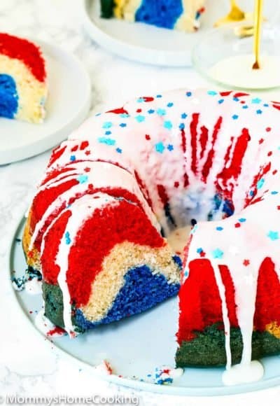 Red, White, and Blue Eggless Bundt Cake over a serving plate.