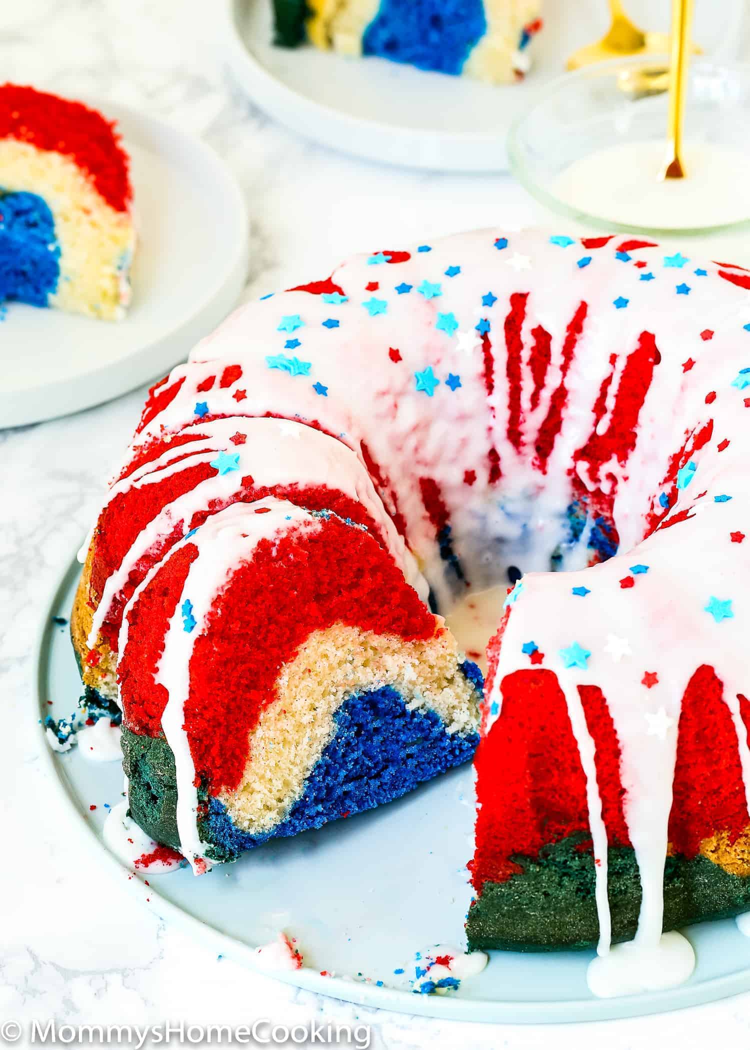 Red, White, and Blue Eggless Bundt Cake served on a plate.