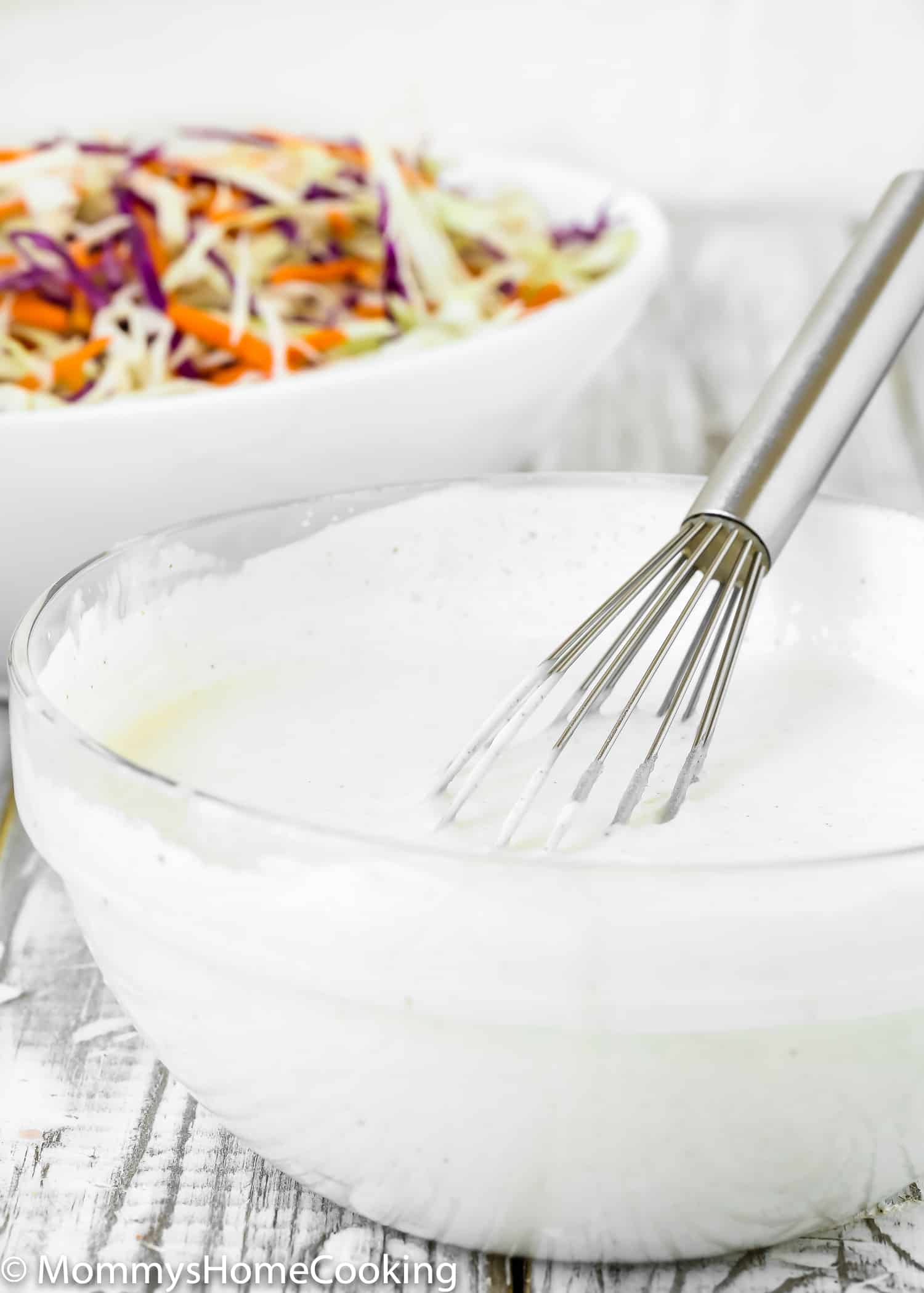 buttermilk salad dressing in a bowl with a whisk. 