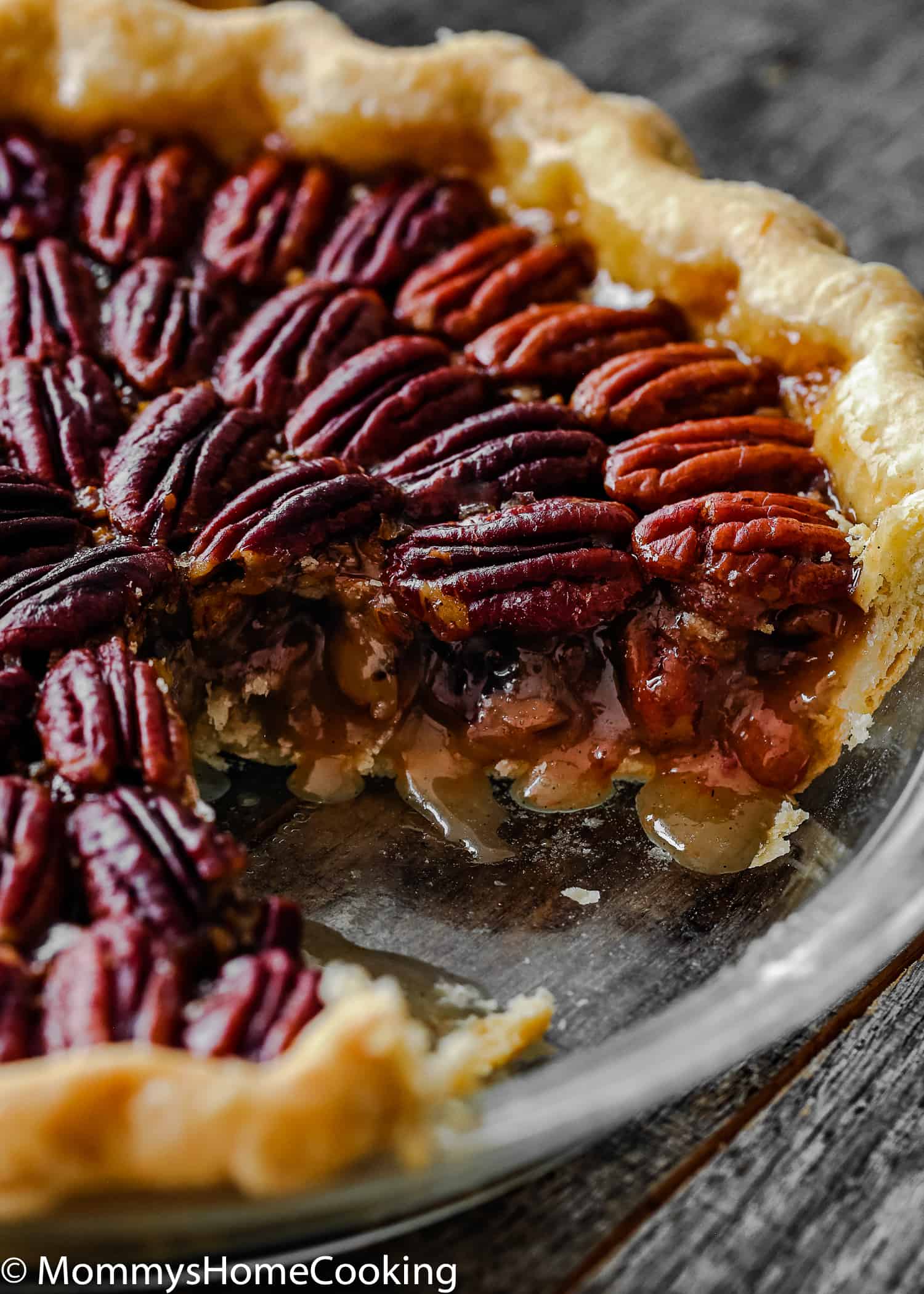 Eggless Pecan Pie sliced in a pie dish. 