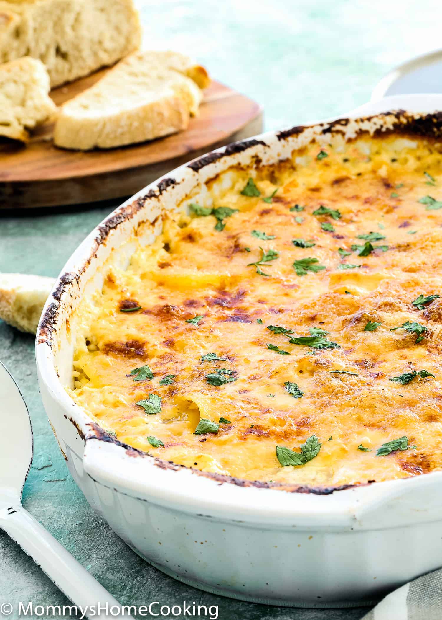 Creamy and cheesy Fish Casserole garnished with chopped parsley. 