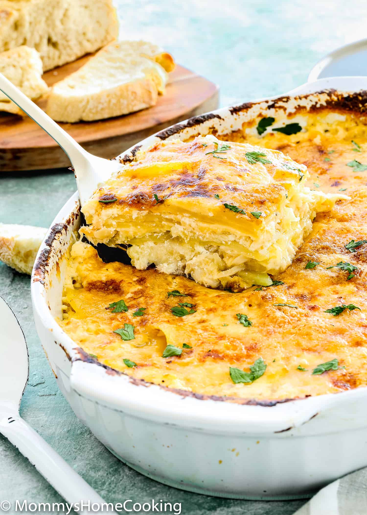 This Cheesy Potatoes and Cod Casserole recipe is cheesy, creamy, and easy to make! Loaded Potato, cheese and cod, this dish is a whole dinner in one! For sure a go-to dinner for any day of the week. https://mommyshomecooking.com