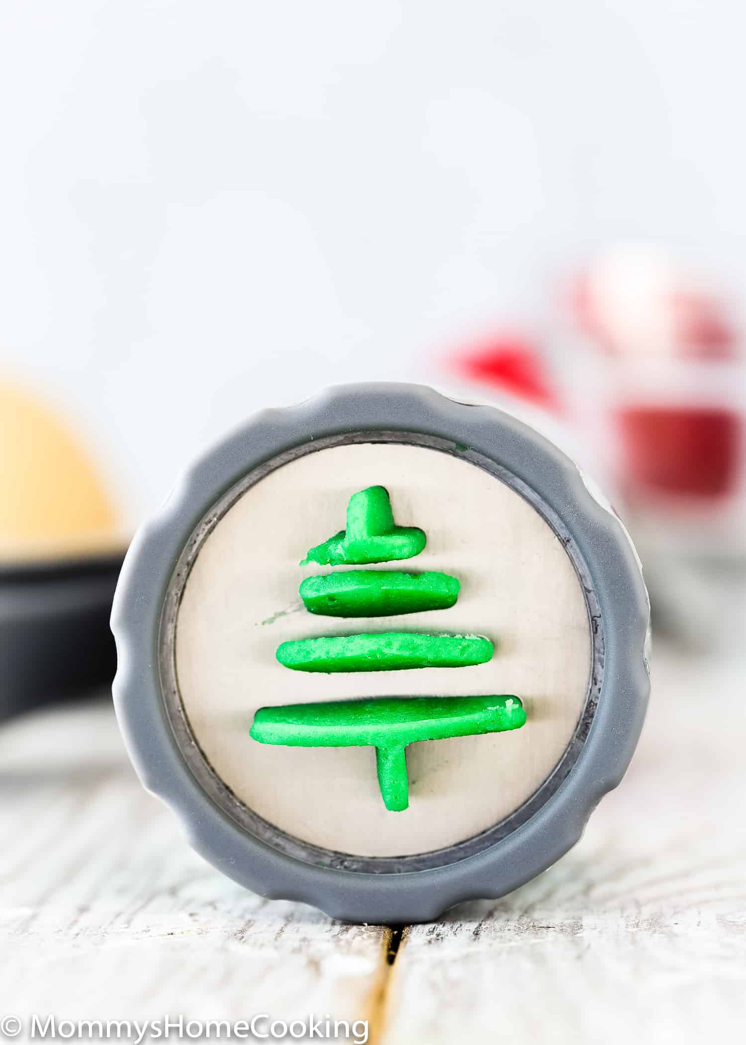 These Easy Eggless Spritz Cookies are tender, light, buttery and totally delicious. Easy and quick to make; no cookie dough chilling required. These egg-free cookies will make a great dessert contribution to any holiday party. https://mommyshomecooking.com