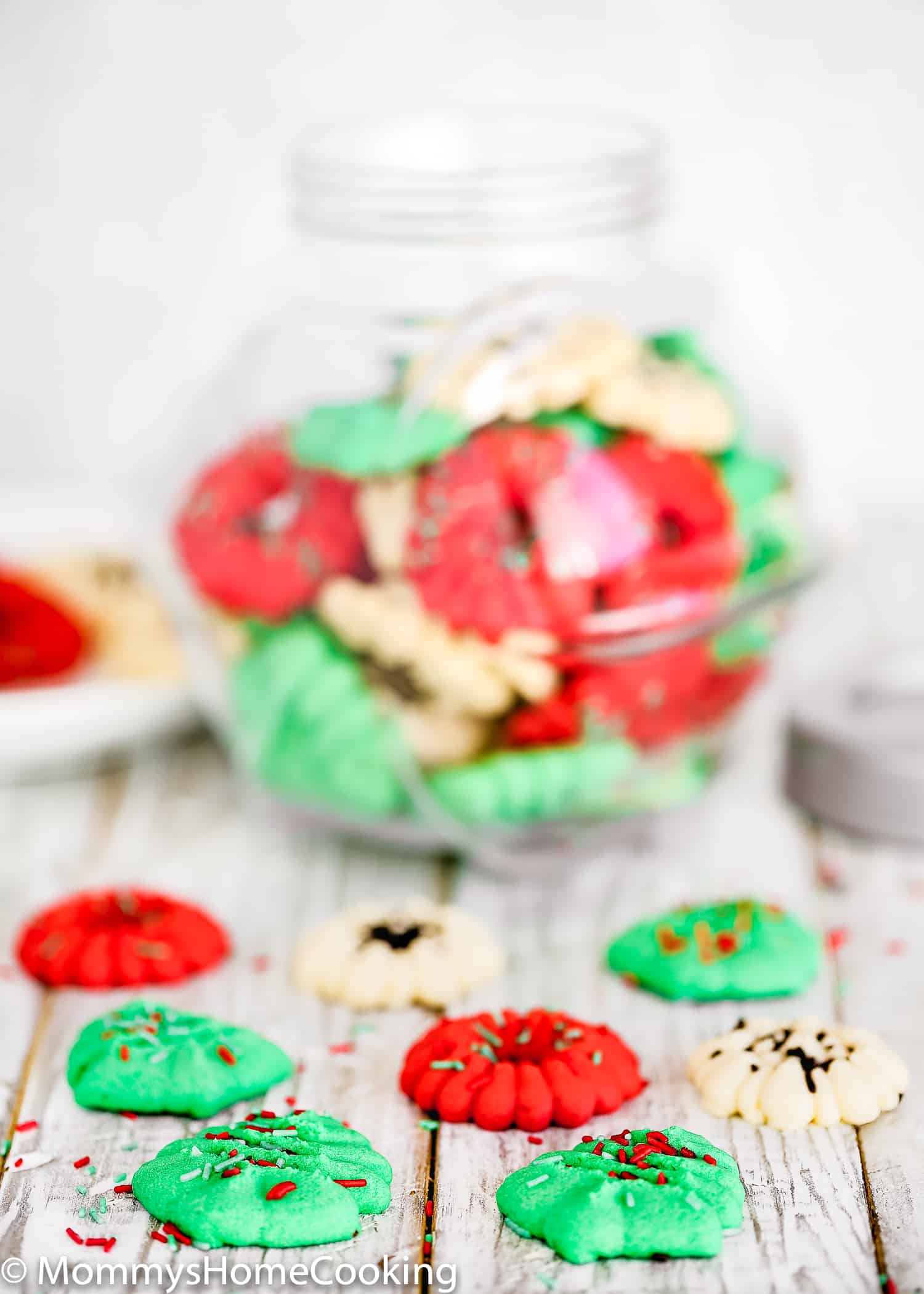 These Easy Eggless Spritz Cookies are tender, light, buttery and totally delicious. Easy and quick to make; no cookie dough chilling required. These egg-free cookies will make a great dessert contribution to any holiday party. https://mommyshomecooking.com