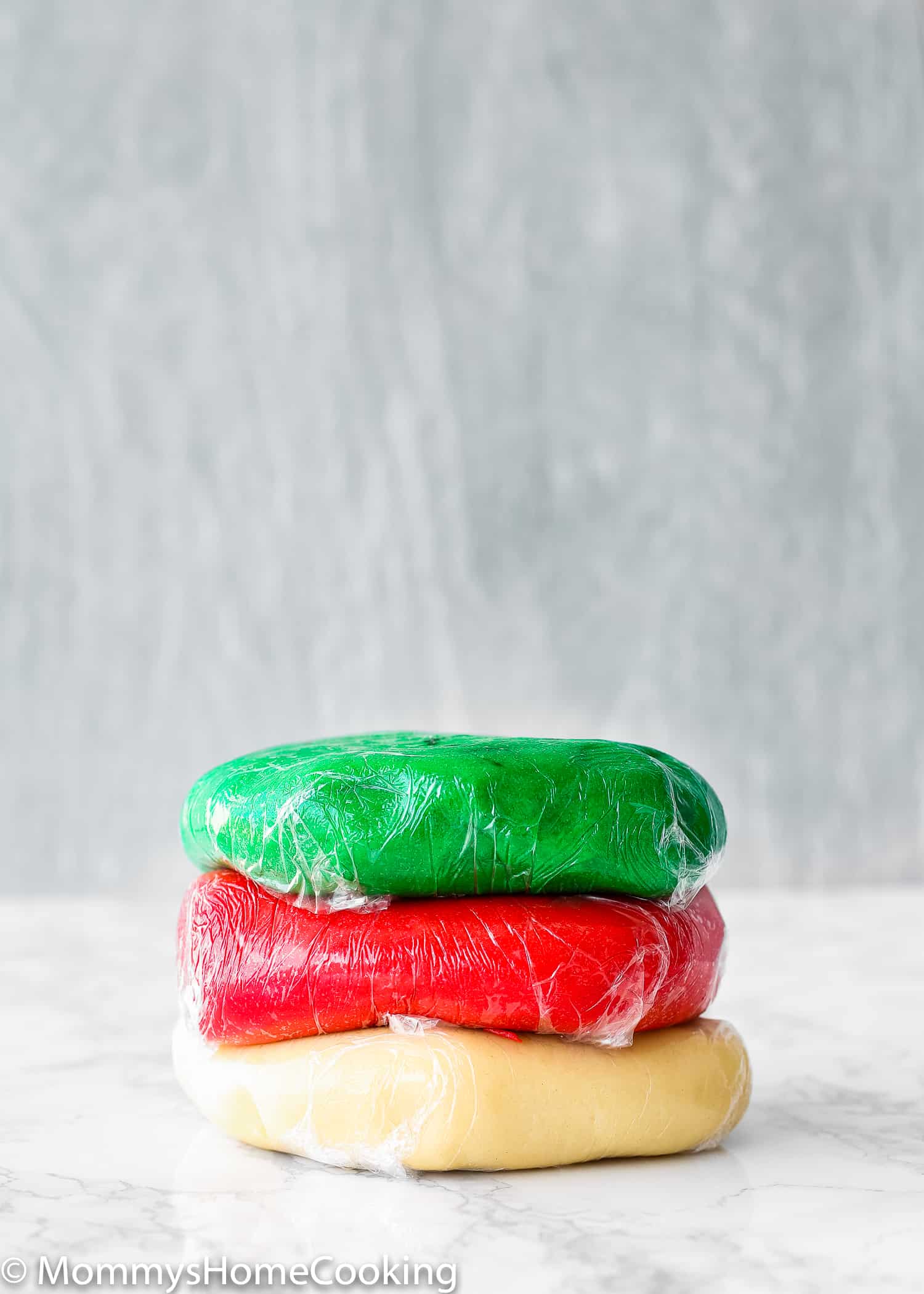Christmas Cookies dough wrapped in plastic wrap