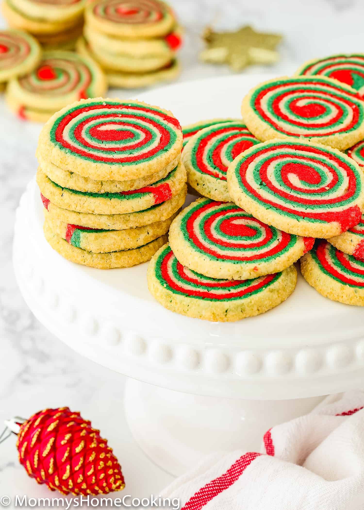  Eggless Icebox Christmas Pinwheel Cookies over a serving plate.