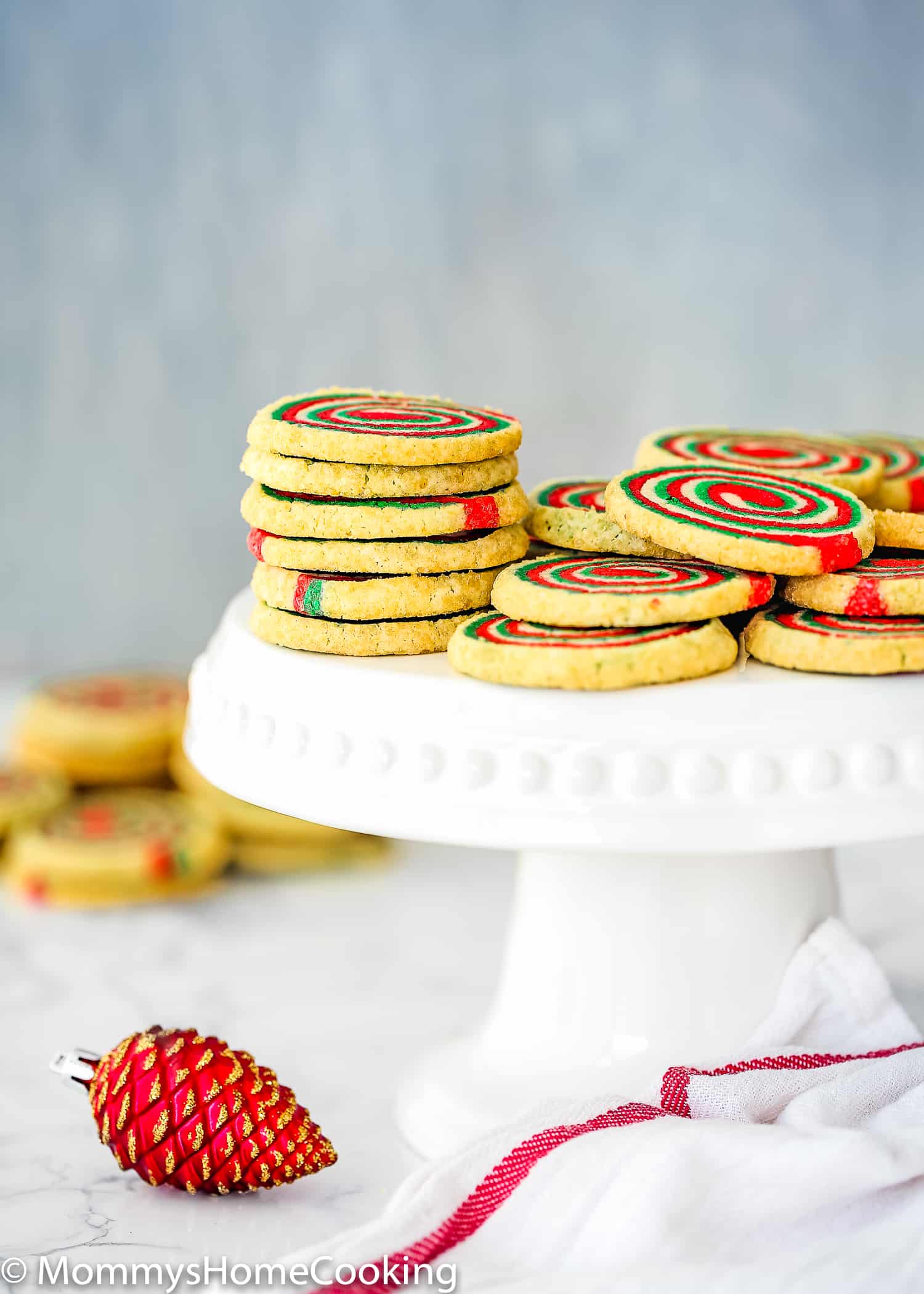 egg-free Christmas Pinwheel Cookies on a cake stand