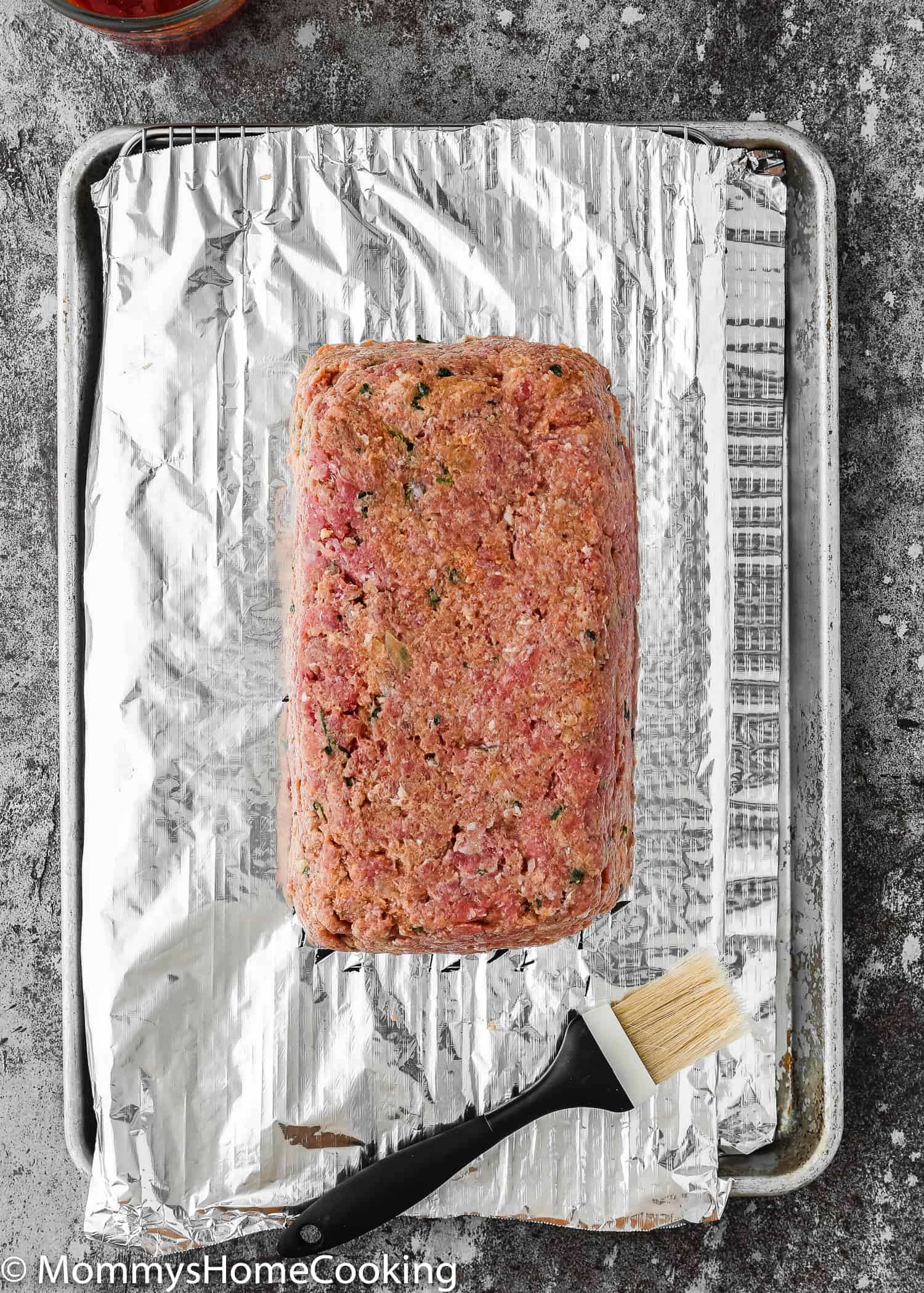  Unbaked Eggless Meatloaf over a baking tray