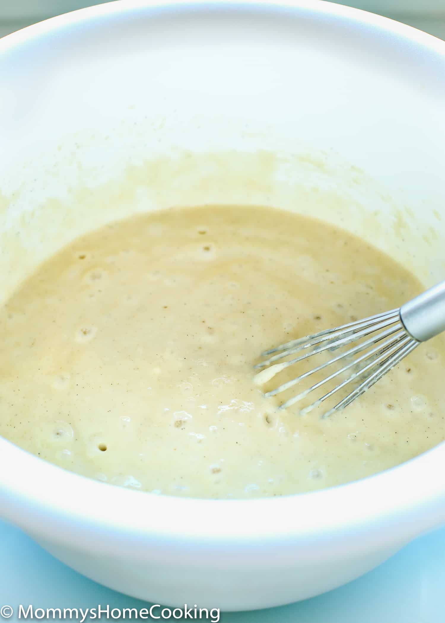 egg-free pancake batter in a bowl with a whisk. 