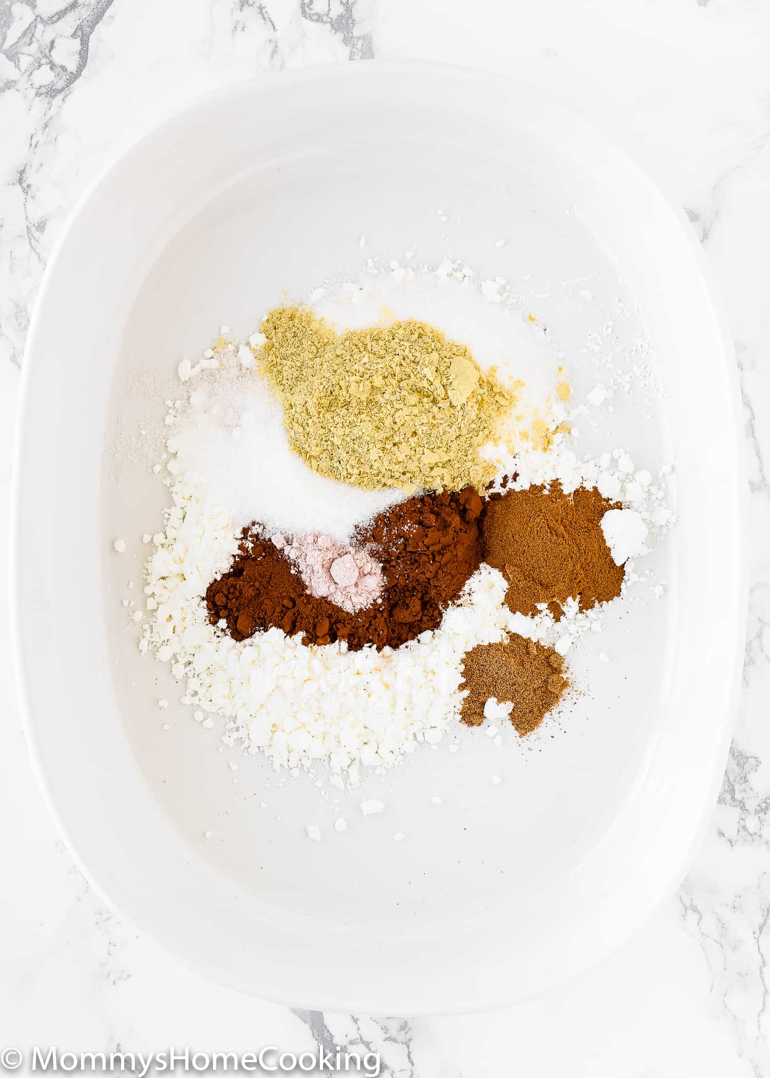 dry ingredients needed to make egg-free french toast in a shallow bowl.