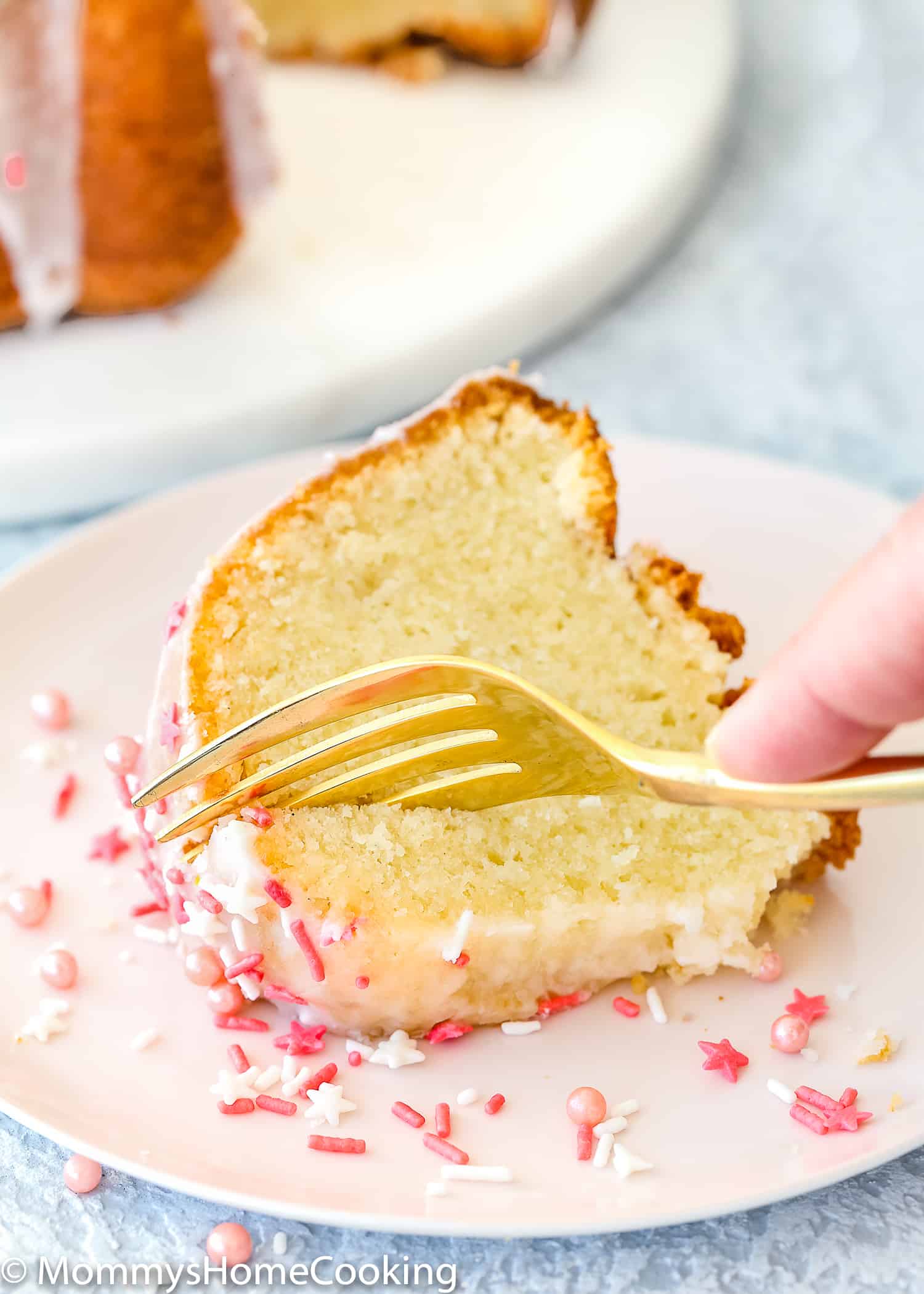 Easy Eggless Vanilla Pound Cake slice on a plate.