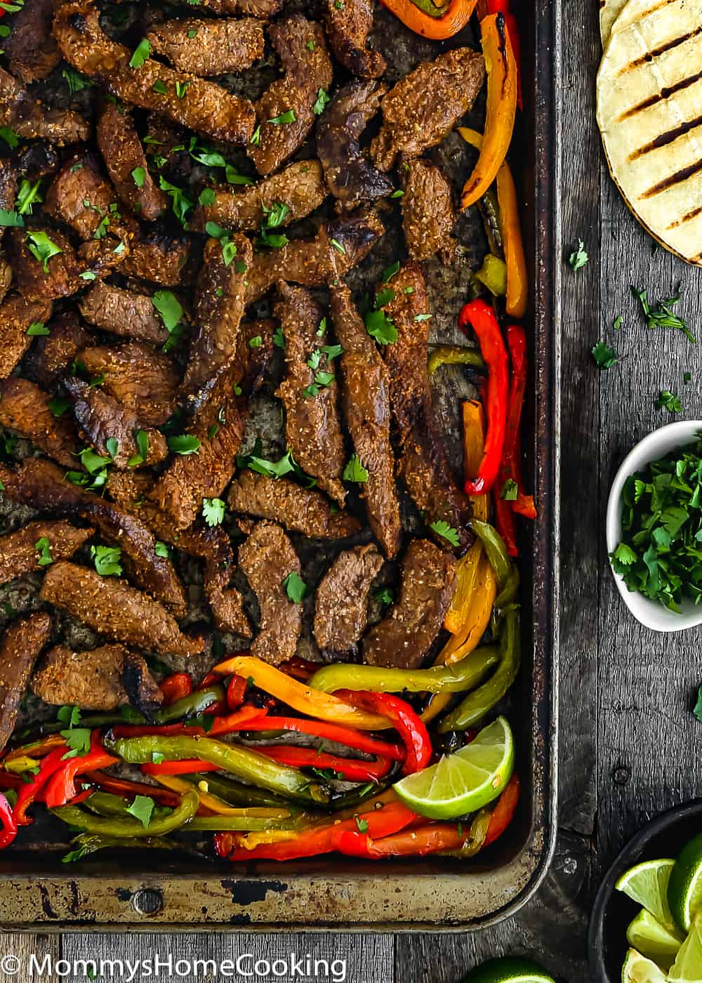 This Easy Sheet Pan Beef Fajitas is zesty, bright, and mess-free! The secret lies in a flavorful marinade. Seasoned beef is oven-broiled on a sheet pan with a mixture of peppers and onions. https://mommyshomecooking.com