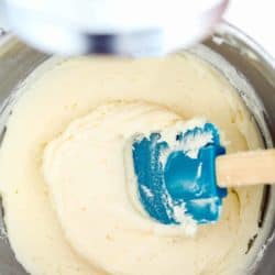 Vanilla Buttercream Frosting in a mixing bowl with a spatula