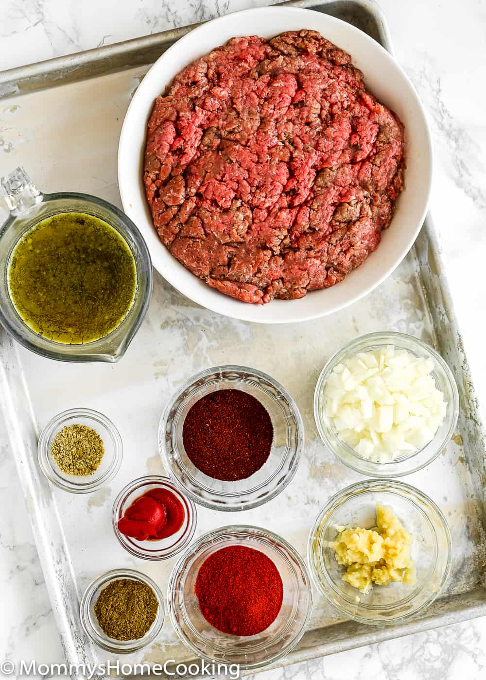 Ingredients needed to make ground beef for tacos.
