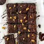 overhead view of Eggless Fudgy Zucchini Brownies over a wooden spoon