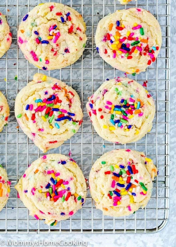 Soft and tender eggless funfetti cookies in a cooling rack