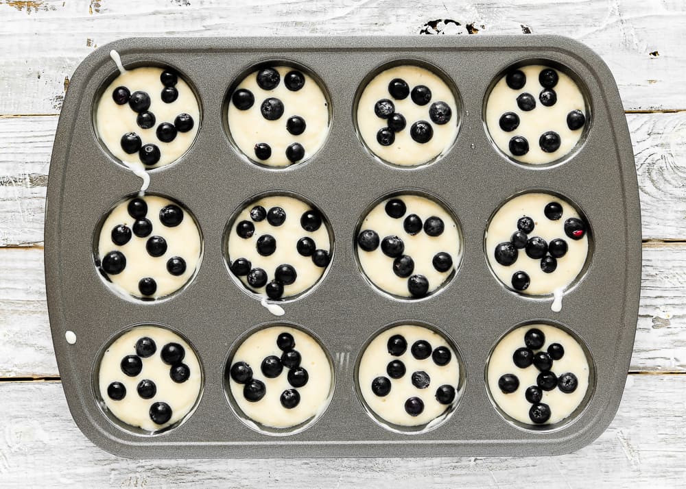 unbaked eggless pancakes muffins in a muffins tin.