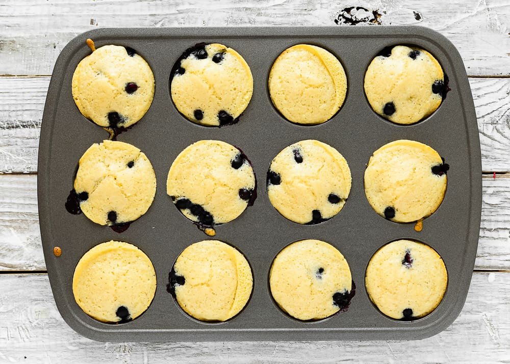 baked eggless pancakes muffins in a muffin pan.