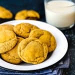 Eggless Pumpkin Snickerdoodles cookies in a plate with a glass of milk