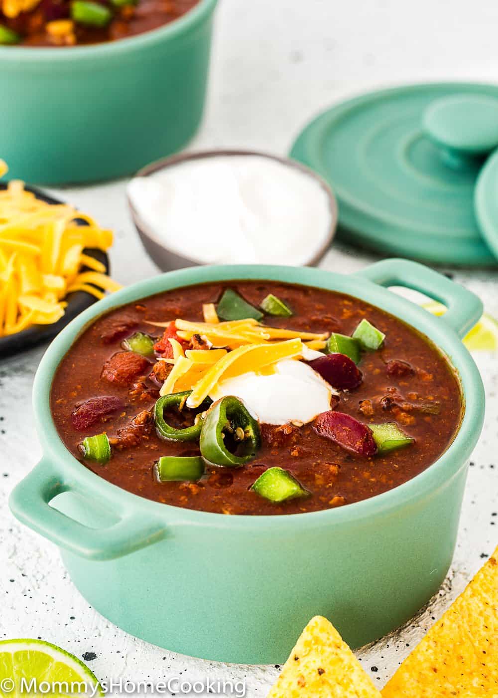 bowl of instant pot chili with jalapeños and sour cream 