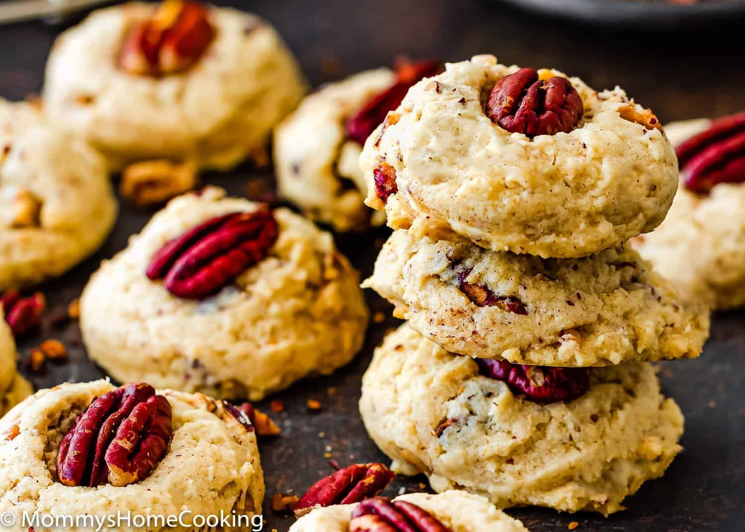Eggless Butter Pecan Cookies stack over a slate surface