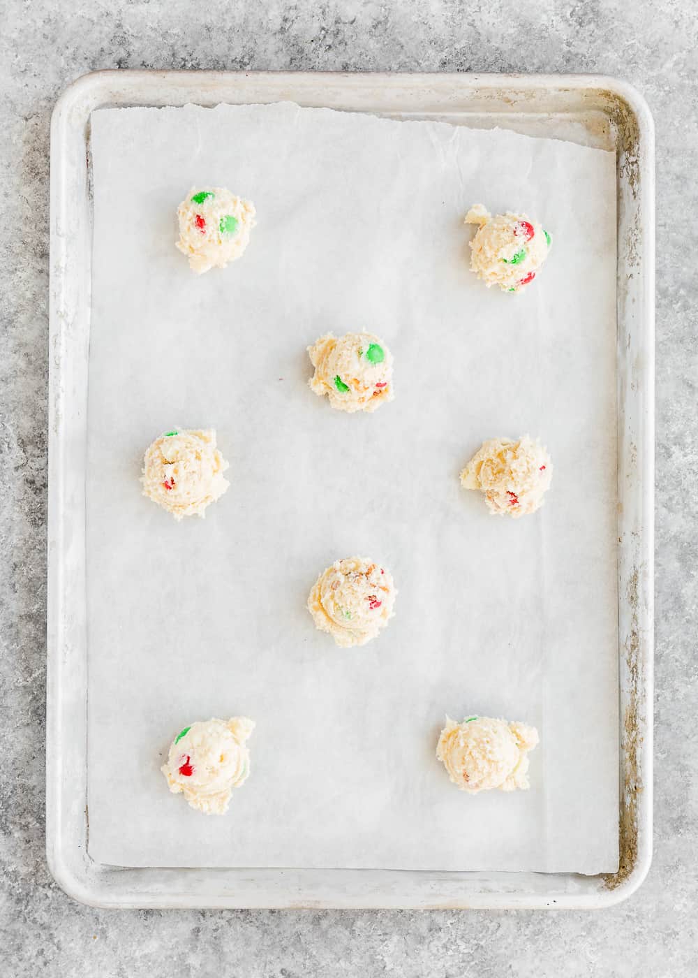 egg-free cookie dough balls on a baking sheet. 