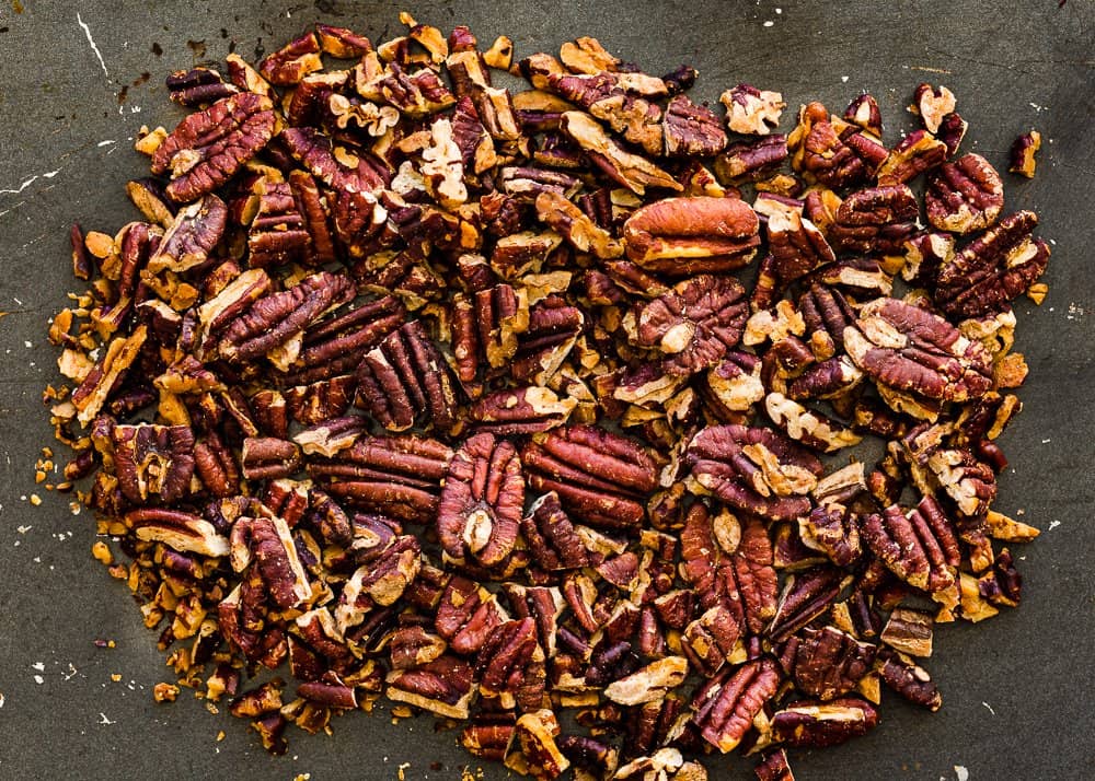 roasted pecan over a dark surface.