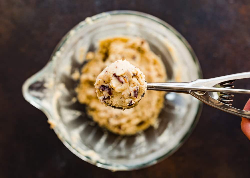 a cookie dough scoop with egg-free pecan cookie dough.