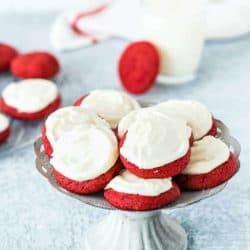 eggless red velvet cookies with cream cheese frosting in a cookie stand