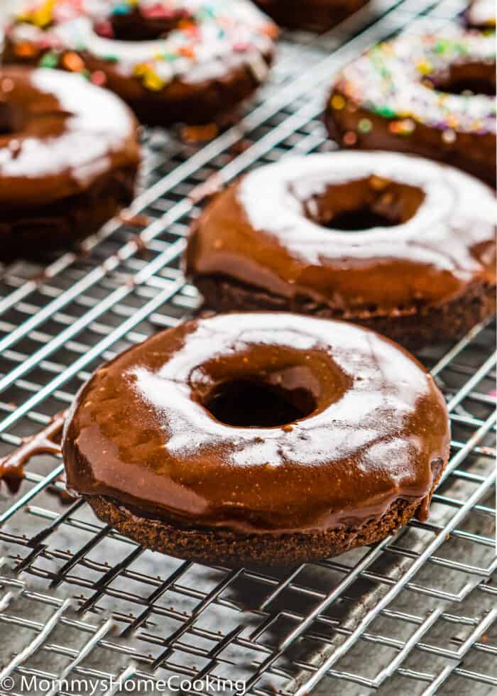 eggless donuts over a cooling rack.
