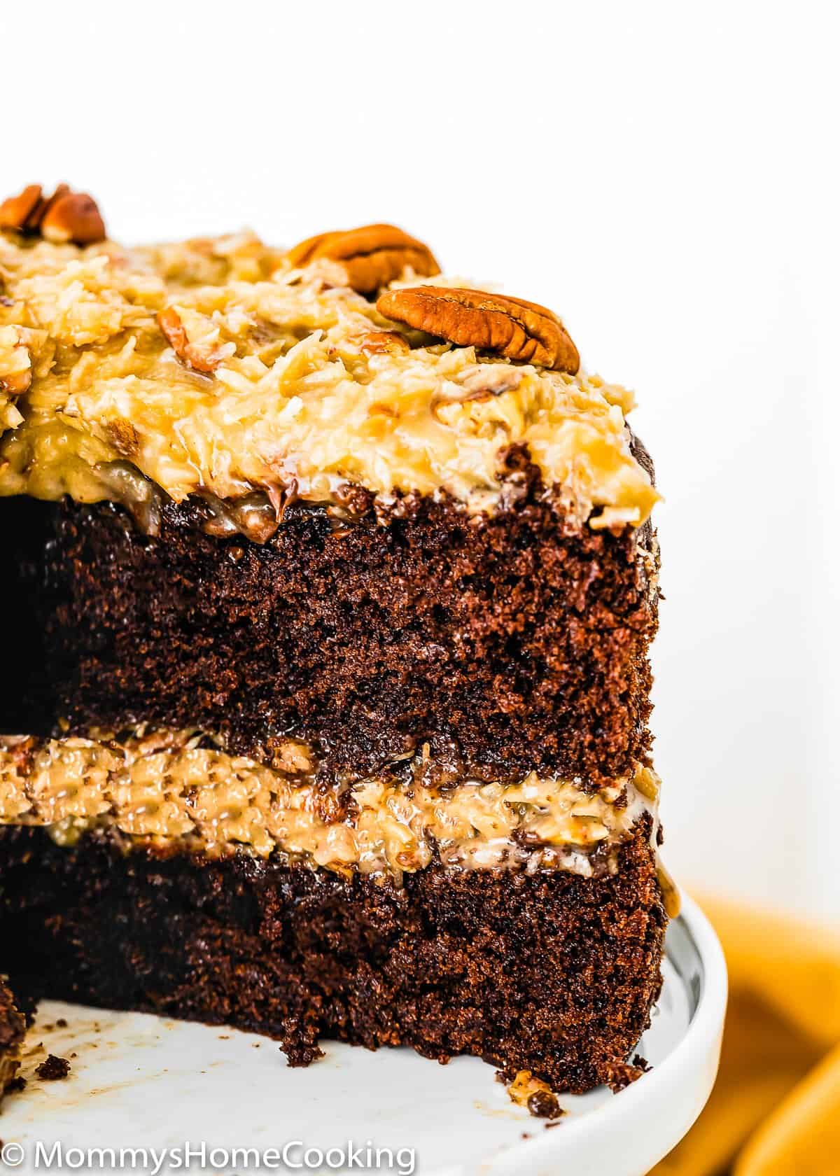 sliced Eggless German Chocolate Cake showing fluffy inside texture