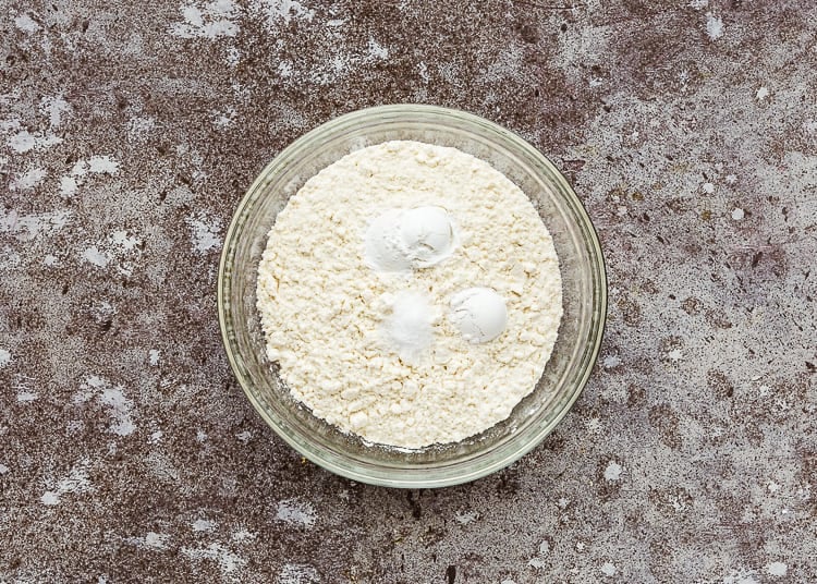 dry ingredients needed to make egg-free marble cake in a bowl. 