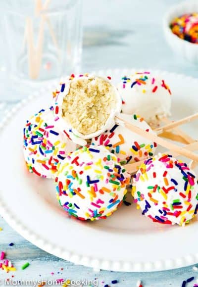 Easy Eggless Homemade Cake Pops in a white plate showing the inside texture