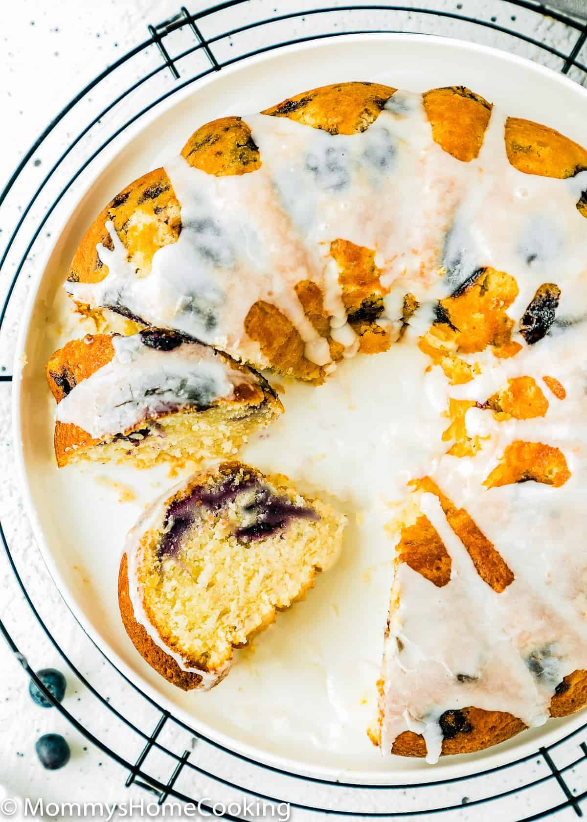 Eggless Lemon Blueberry bundt Cake sliced on a plate.