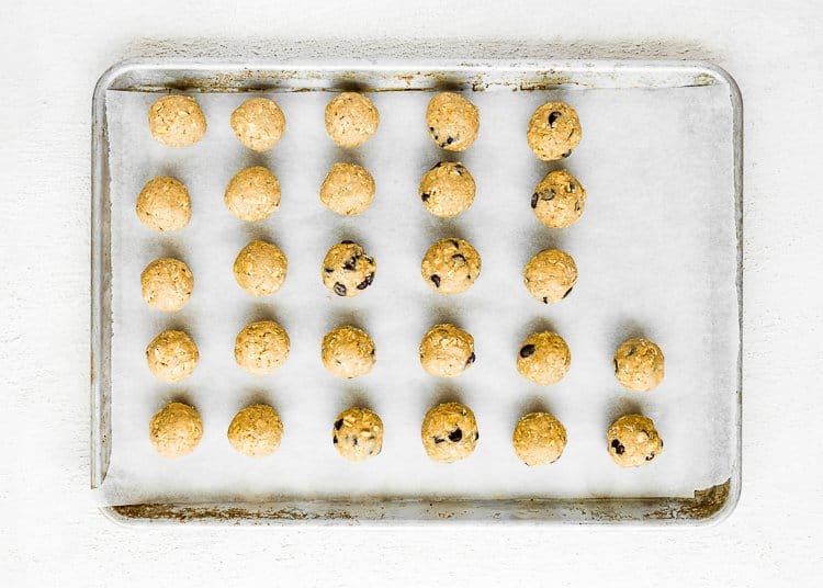 egg-free oatmeal dough balls on a baking sheet. 
