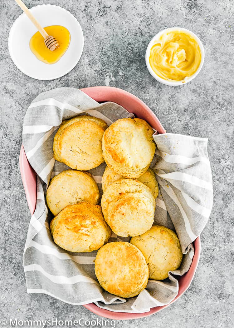Eggless Biscuits in a pink basket with honey and butter