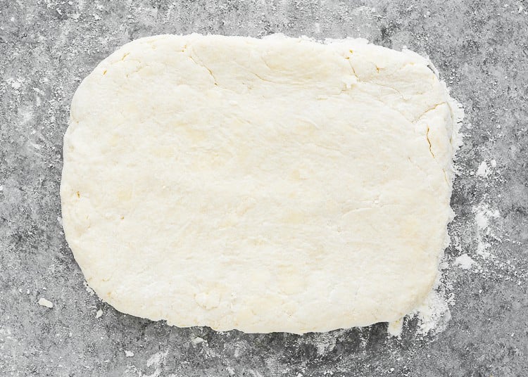 eggless homemade biscuits dough shaped into a rectangle.