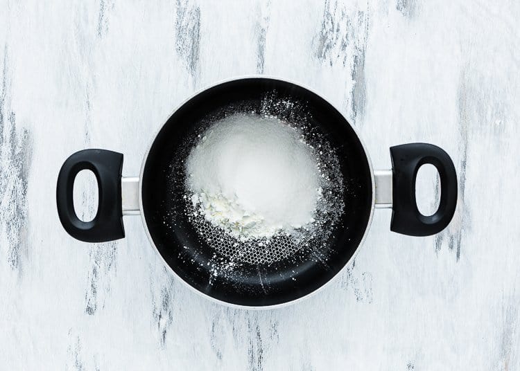 a saucepan with sugar, cornstarch, and salt.