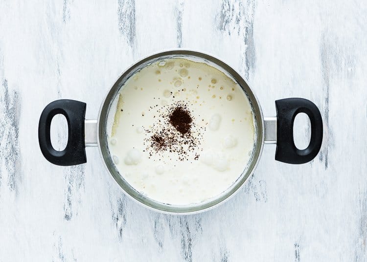 sugar, cornstarch, and salt mix together in a saucepan with evaporated milk, heavy cream, and espresso powder.