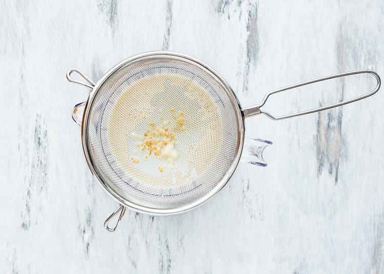 egg-free creme brulee passing through a fine strainer.